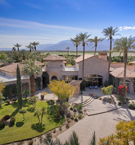 The Main House at Mirabella Estate, a Spanish-style building with arched windows and a red tile roof