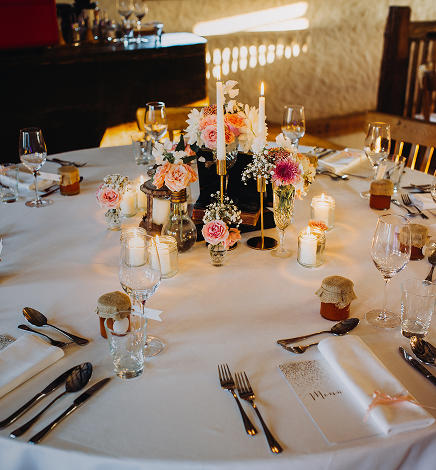 Outdoor event setup on the estate grounds with tables and decor arranged for a private celebration